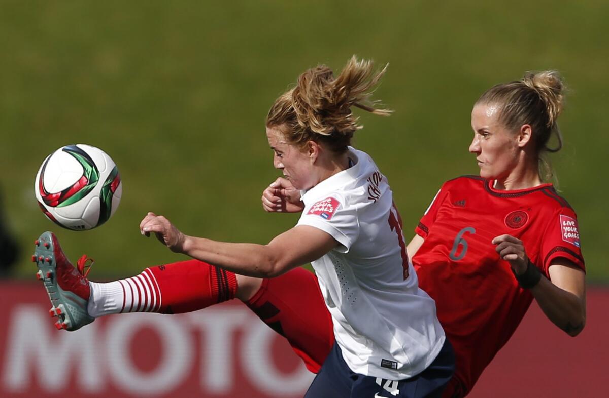 Midfielder's Ingrid Schjelderup of Norway and Simone Laudehr (6) of Germany battle for possession of the ball during their Women's World Cup Group B game on Thursday.