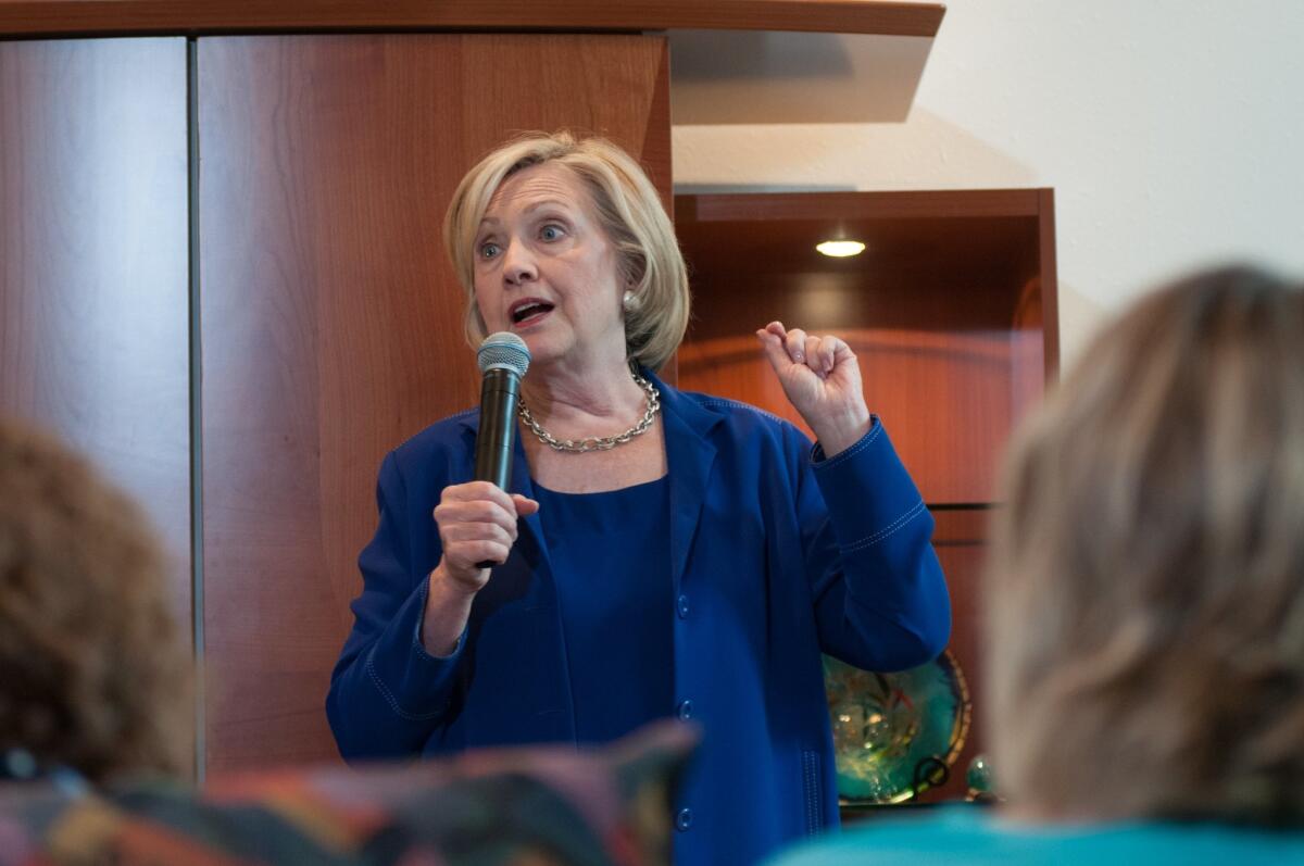 Democratic presidential candidate Hillary Clinton addresses supporters at an organizational rally at the home of Nancy and Danny Emanuel on July 7, 2015, in Ottumwa, Iowa.