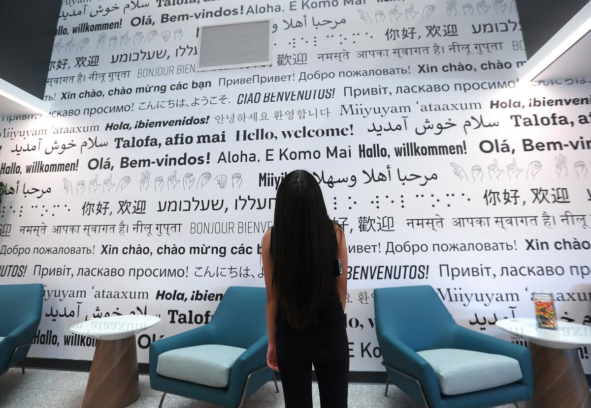 The new welcome wall is written in 15 different languages.