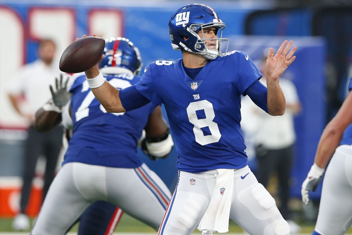FILE - In this Sunday, Aug. 29, 2021, file photo, New York Giants quarterback Daniel Jones (8) throws a pass during the first half of an NFL preseason football game against the New England Patriots in East Rutherford, N.J. The Giants take on the Denver Broncos on Sunday. (AP Photo/Noah K. Murray, File)
