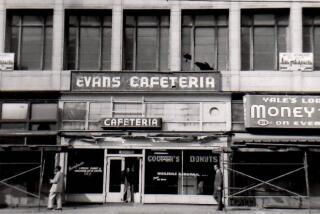 A 1958 view of the exterior of Evans Cafeteria on 215 Main Street, where Cooper Do-nuts were originally manufactured and which later moved to 213 Main Street as Cooper Do-nuts. Cooper Do-nuts, which had its first location on the corner of 2nd and Main streets, was known as a safe haven for the LGBTQ+ community during the 1950s and '60s.
