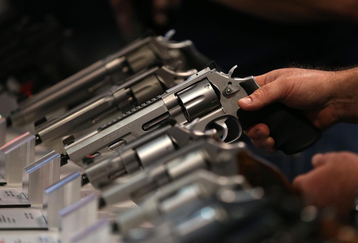 Smith and Wesson handguns are displayed during the 2015 NRA Annual Meeting & Exhibits on April 10 in Nashville.