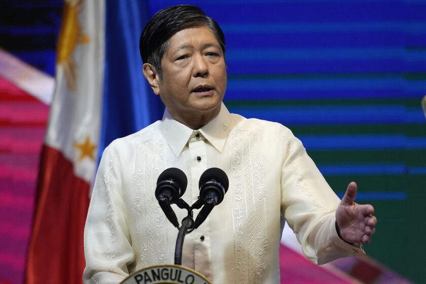 FILE - Philippine President Ferdinand Marcos Jr. gestures during his speech at the 2022 Department of Environment and Natural Resources Multi-stakeholder Forum in Manila, Philippines, on Oct. 5, 2022. Marcos and Japan’s Prime Minister Fumio Kishida are expected to sign key agreements to boost their defense ties Thursday, Feb. 9, 2023, as Asia sees tensions around China’s growing influence. (AP Photo/Aaron Favila, File)