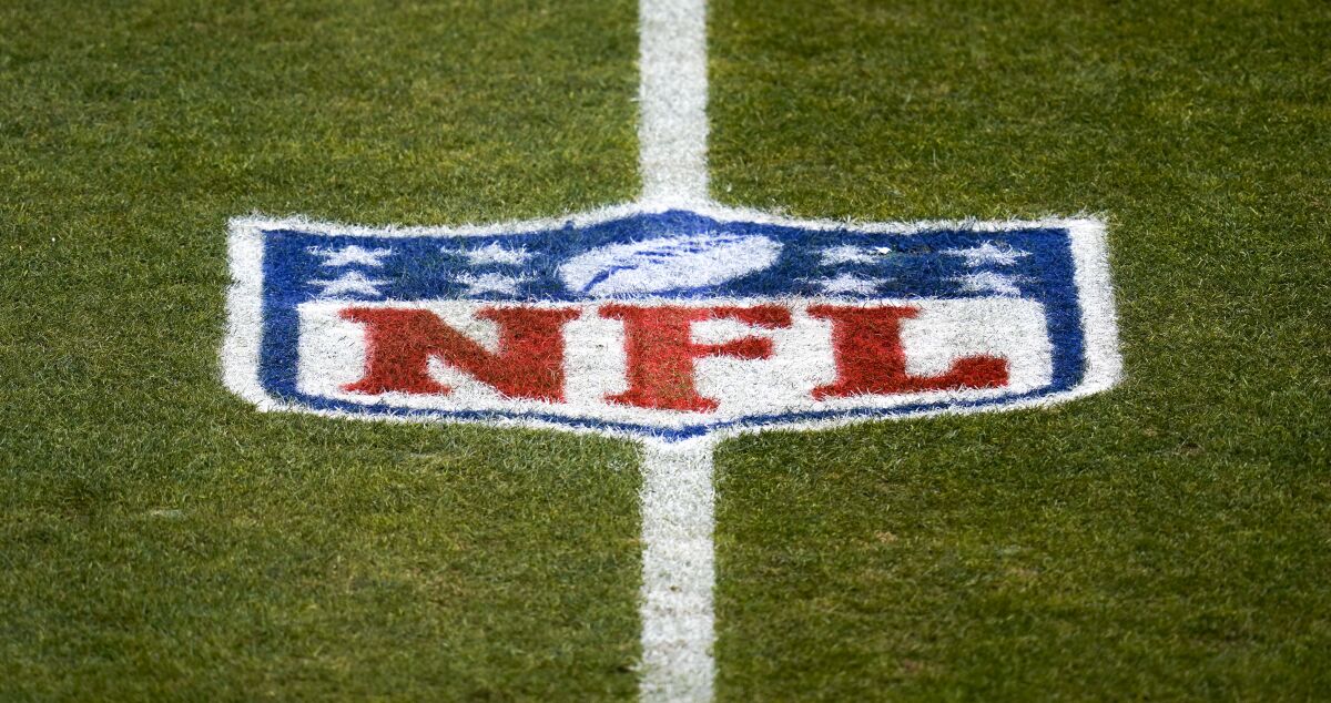 The NFL logo on a football field