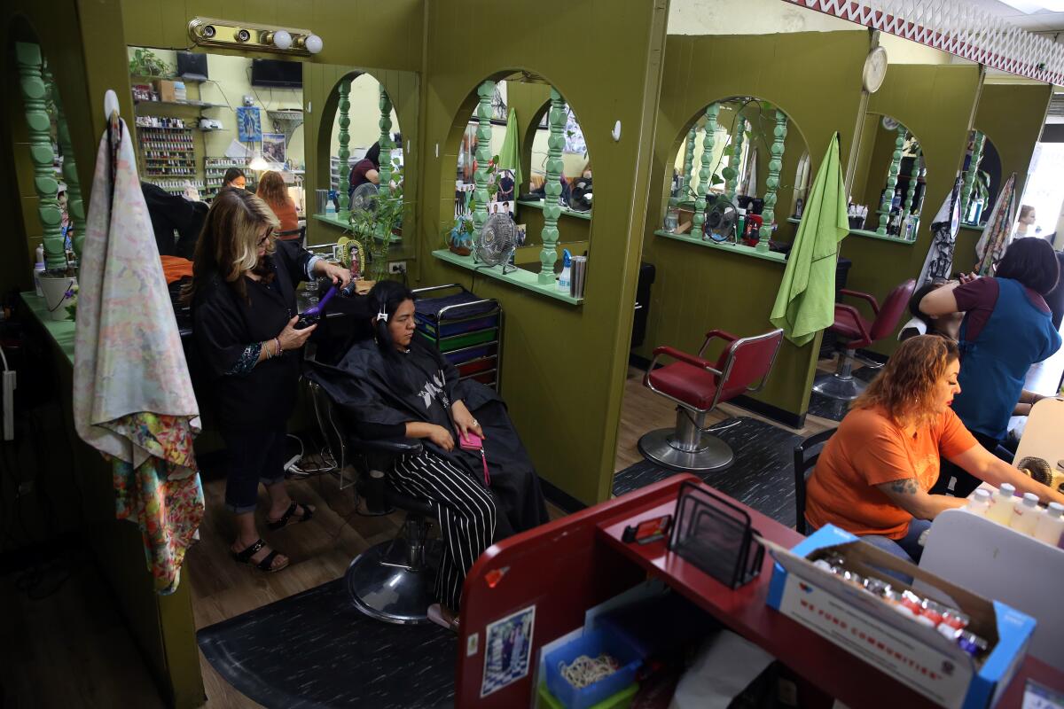 Marta Vasquez does Margarita Cortez's hair
