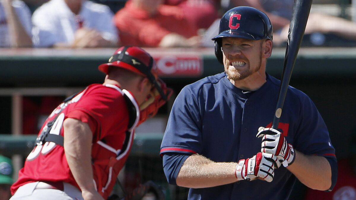 Cleveland Indians first baseman Brandon Moss grimaces after striking out during an exhibition game against the Cincinnati Reds on March 17.