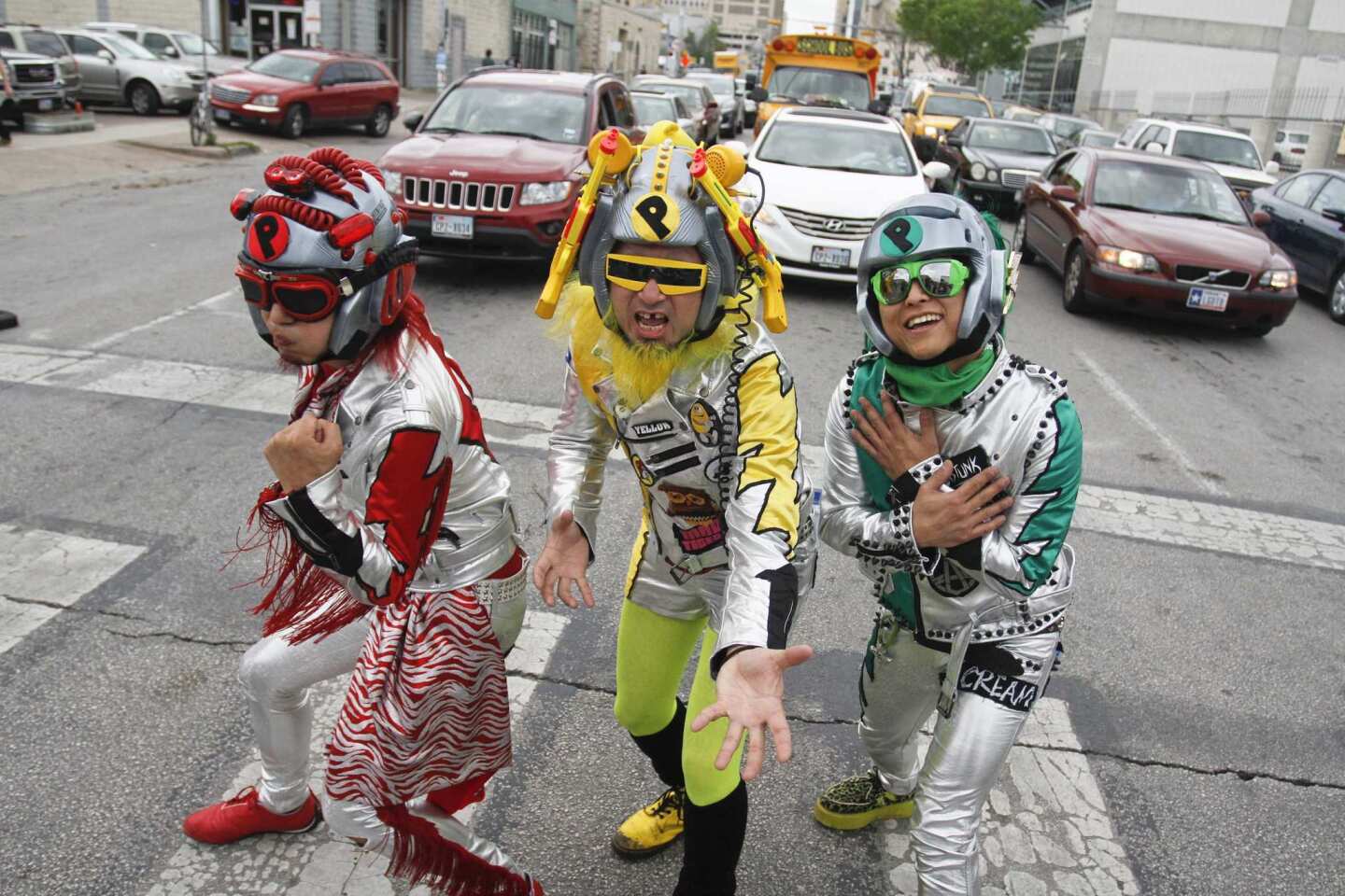 Members of Peelander-Z, from New York via Japan, stop to pose in a crosswalk in downtown Austin, Texas.