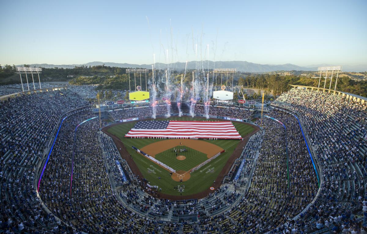 Fireworks shoot off after Dodgers players are introduced before the team's home opener.