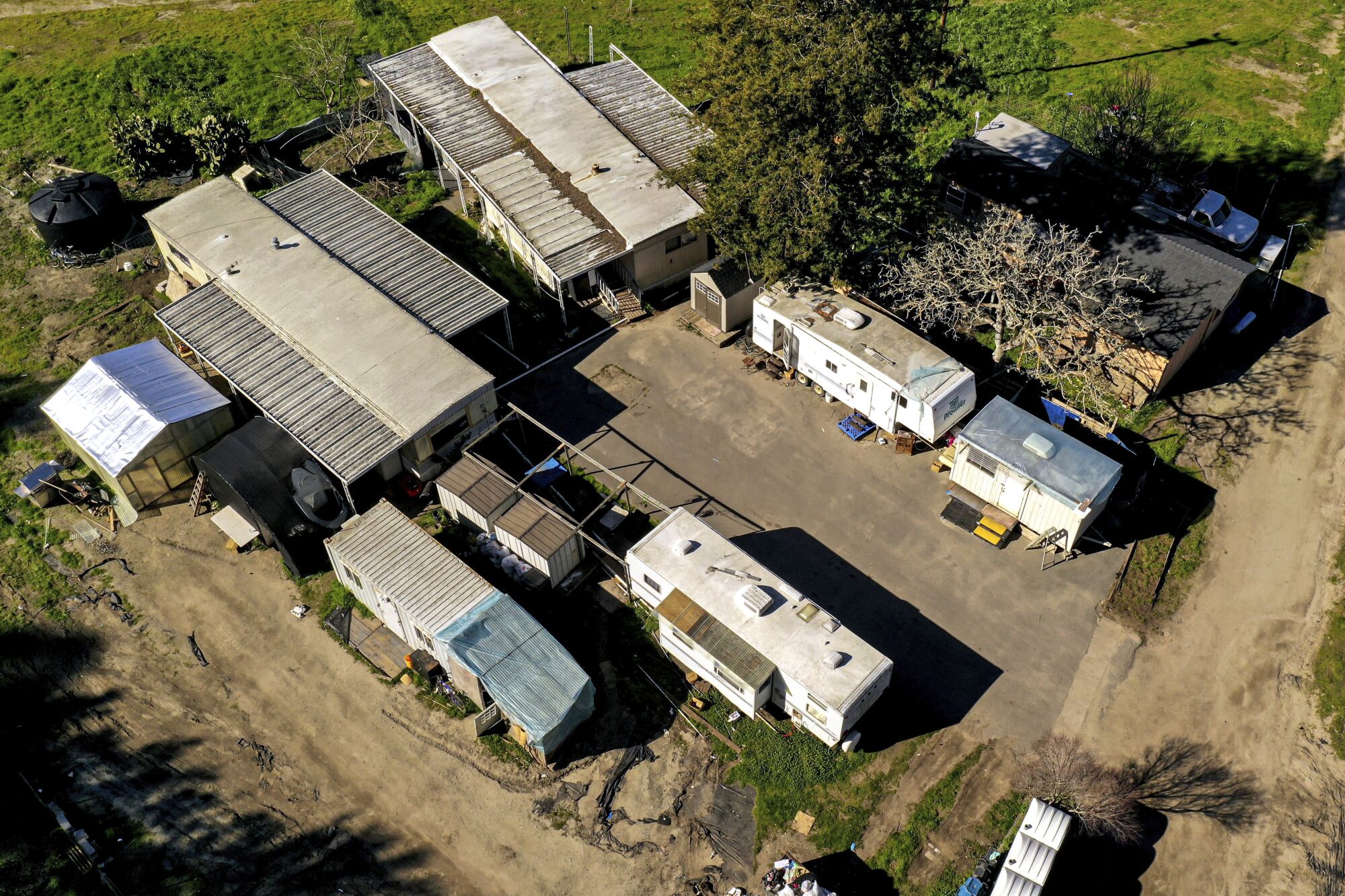 An aerial view of mobile homes on a farm
