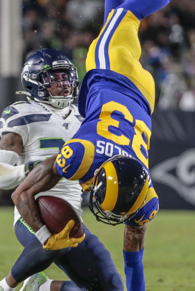 Rams wide receiver Josh Reynolds is flipped by Seattle Seahawks cornerback Quandre Diggs.