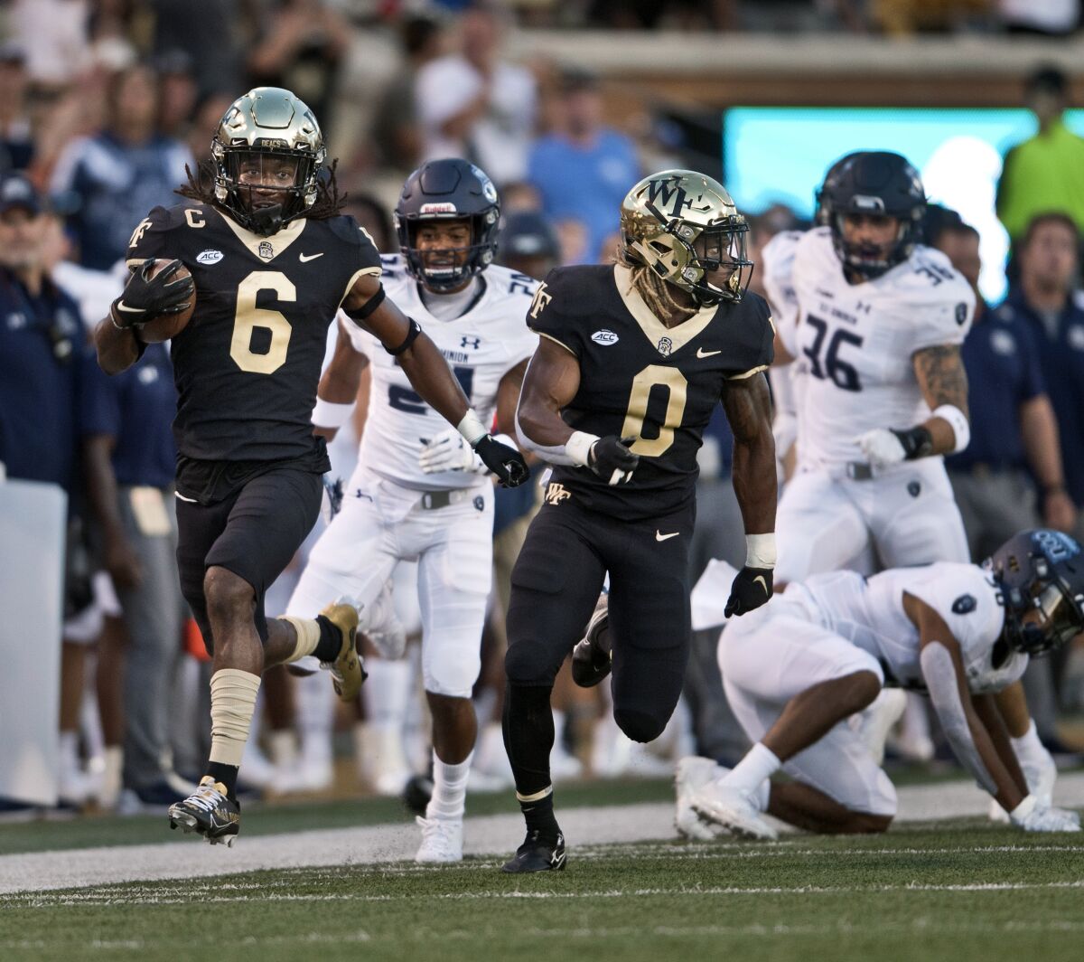 Wake Forest's Ja'Sir Taylor (6) takes a kickoff return in for a first-half touchdown against Old Dominion during an NCAA college football game Friday, Sept. 3, 2021, in Winston-Salem, N.C. (Walt Unks/The Winston-Salem Journal via AP)