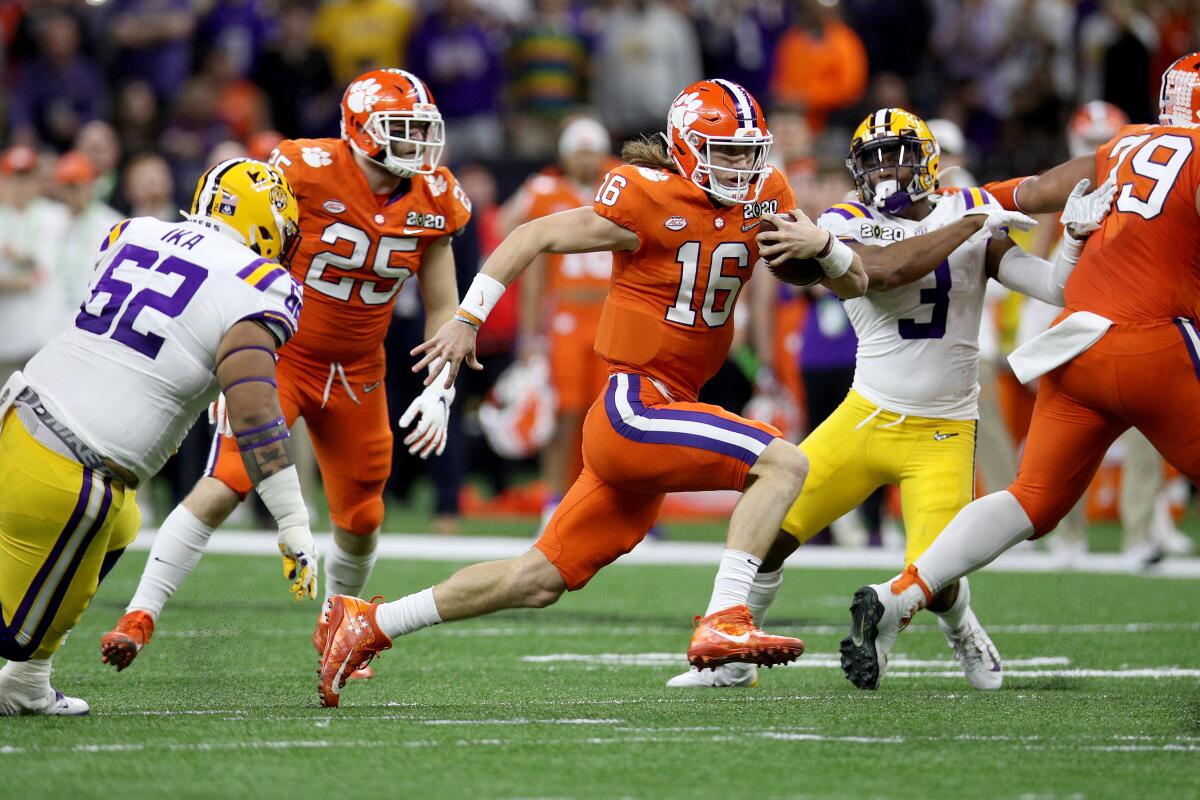 Clemson quarterback Trevor Lawrence runs the ball against LSU during the first half in the College Football Playoff championship game on Monday in New Orleans.