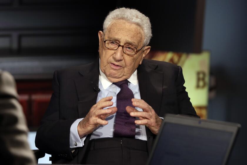 FILE - Former U.S. Secretary of State Henry Kissinger is interviewed by Neil Cavuto on his "Cavuto Coast to Coast" program on the Fox Business Network, June 5, 2015, in New York. Kissinger, the diplomat with the thick glasses and gravelly voice who dominated foreign policy as the United States extricated itself from Vietnam and broke down barriers with China, died Wednesday, Nov. 29, 2023. He was 100. (AP Photo/Richard Drew, File)