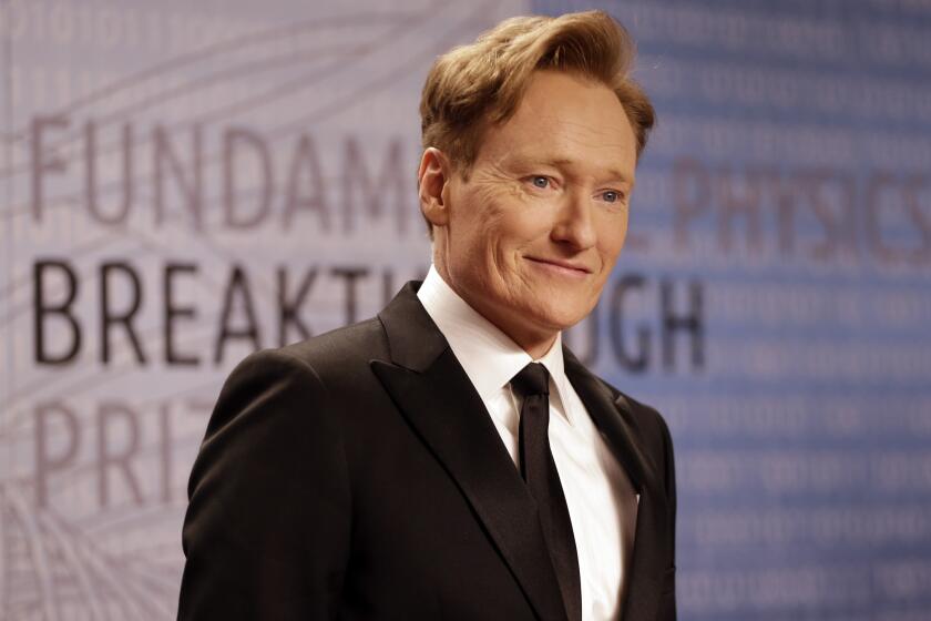 Conan O'Brien arrives for the Breakthrough Prize in Life Sciences awards in Moffett Field, Calif. O'Brien announced on his TBS talk show "Conan" that he's hosting this year's MTV Movie Awards.
