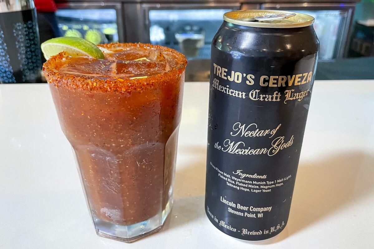 The michelada at Trejo's Tacos in Hollywood next to a can of Trejo's Cerveza.