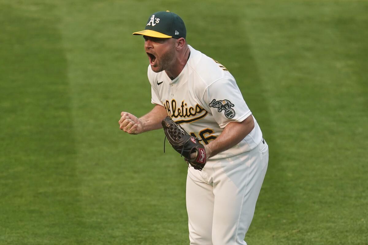 Oakland Athletics pitcher Lou Trivino pitching during the ninth