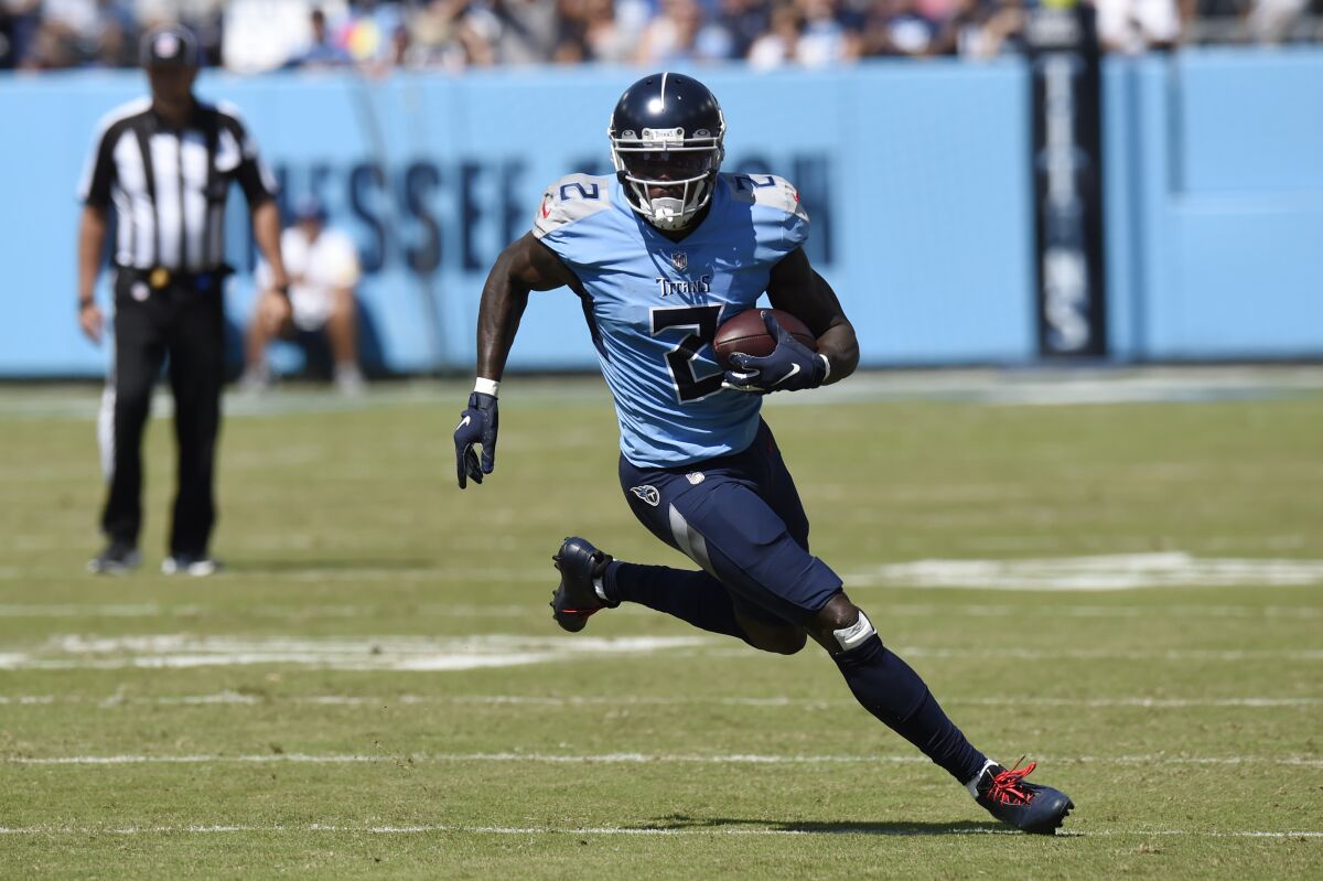 Tennessee Titans wide receiver Julio Jones carries the ball against the Indianapolis Colts in the first half of an NFL football game Sunday, Sept. 26, 2021, in Nashville, Tenn. (AP Photo/Mark Zaleski)