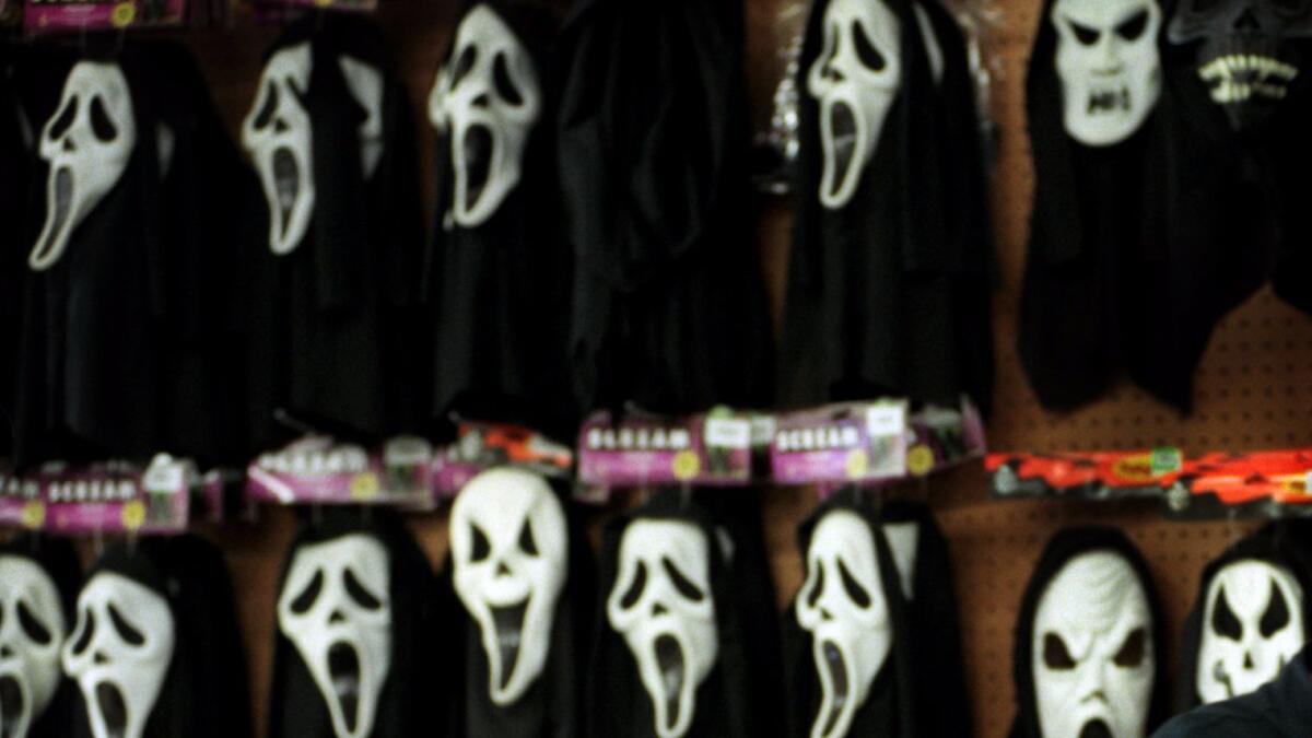 A teen wearing a “Scream” Halloween costume is accused of pointing a gun at a middle school teacher who was in class with students in Ontario.
