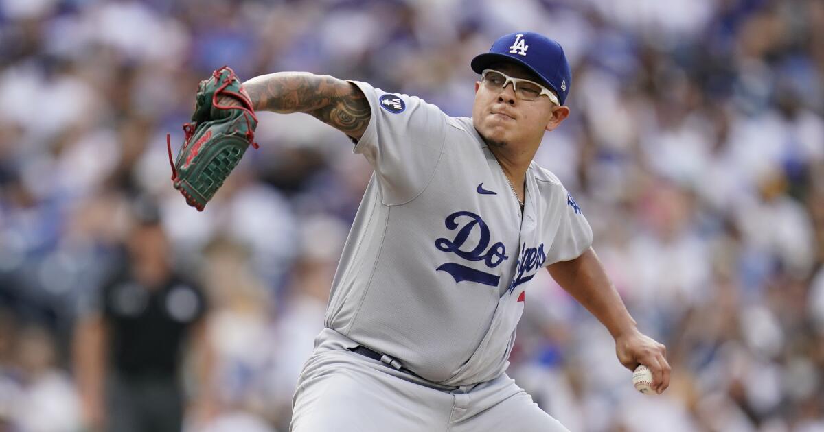 Dodger pitcher Julio Urias reacts as he meets Miles Urias, a young