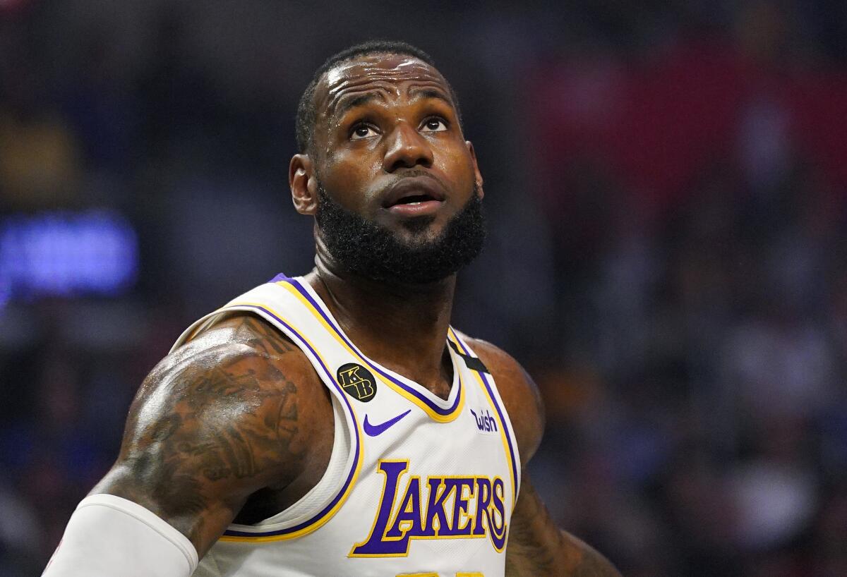 Lakers forward LeBron James watches for a rebound.