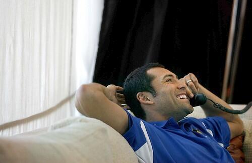 Relaxing in his penthouse at the MGM Grand, Oscar De La Hoya gets a laugh while on the phone.
