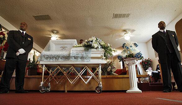 A white casket held 6-year-old Dae'von Bailey, wearing a white suit, during his funeral at Light of the World Church of God in Christ in Compton.