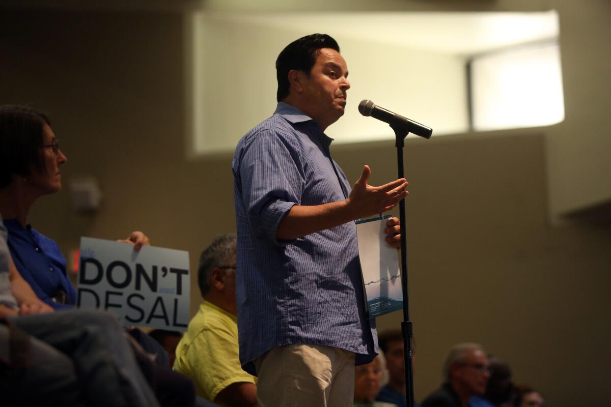 A person speaks into a microphone.