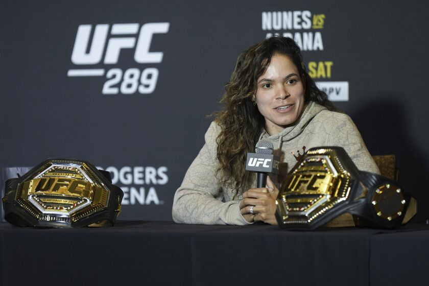 Amanda Nunes responds to questions during a news conference ahead of her fight against Irene Aldana at UFC 289, in Vancouver, British Columbia, Wednesday, June 7, 2023. (Darryl Dyck/The Canadian Press via AP)