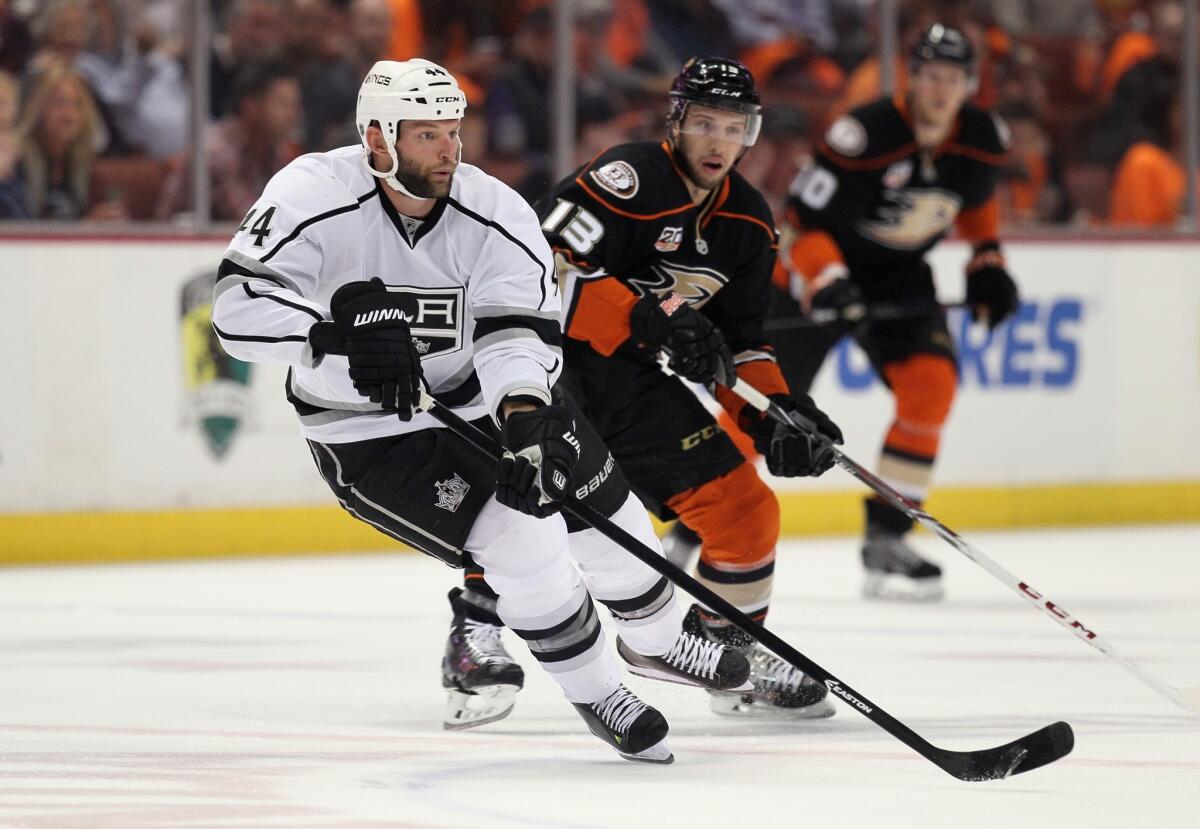 Kings defenseman Robyn Regehr is pursued by the Ducks' Nick Bonino in Game 1 of their series on May 3.