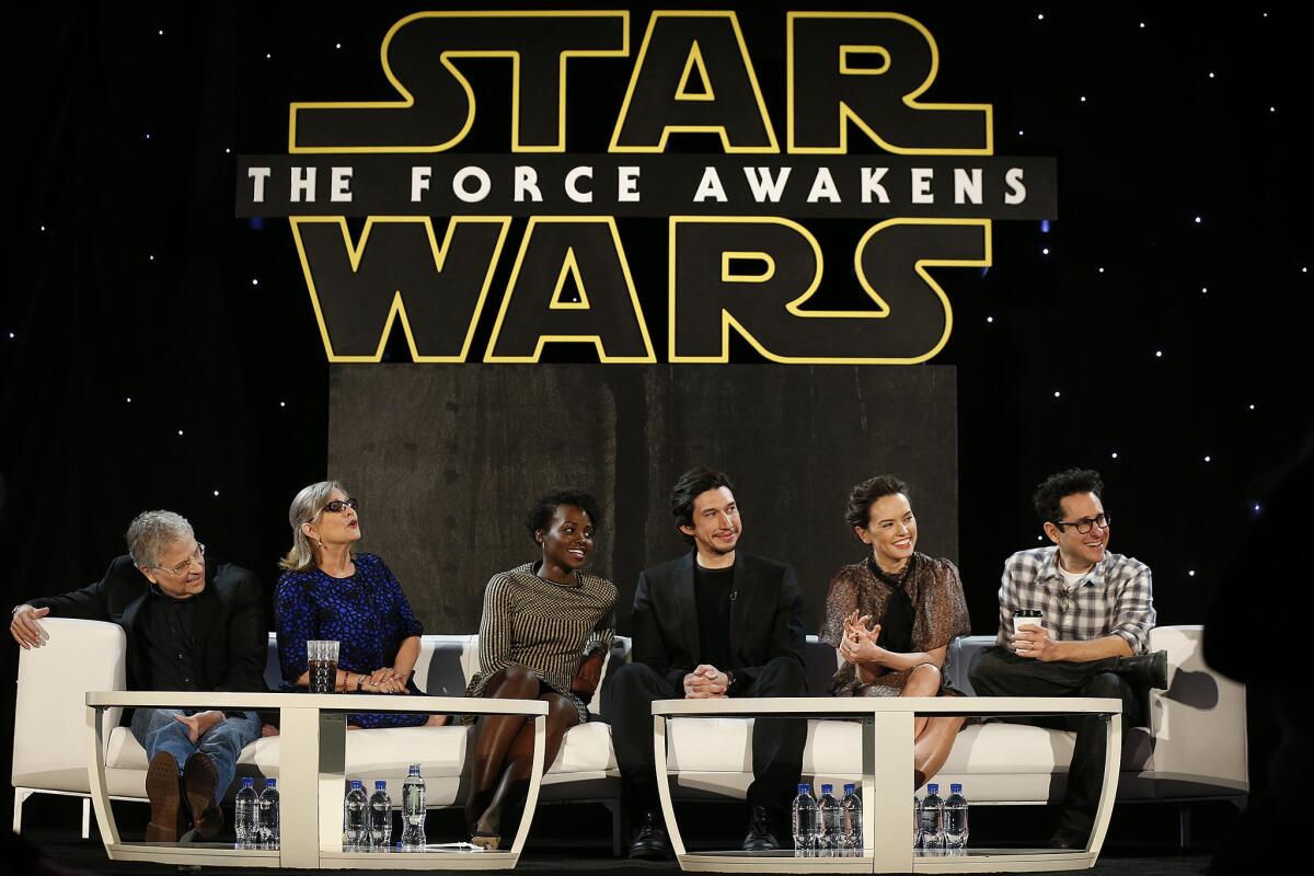 Writer Lawrence Kasdan, from left, Carrie Fisher, Lupita Nyong'o, Adam Driver, Daisy Ridley and J.J. Abrams appear at a press junket for "Star Wars: The Force Awakens."