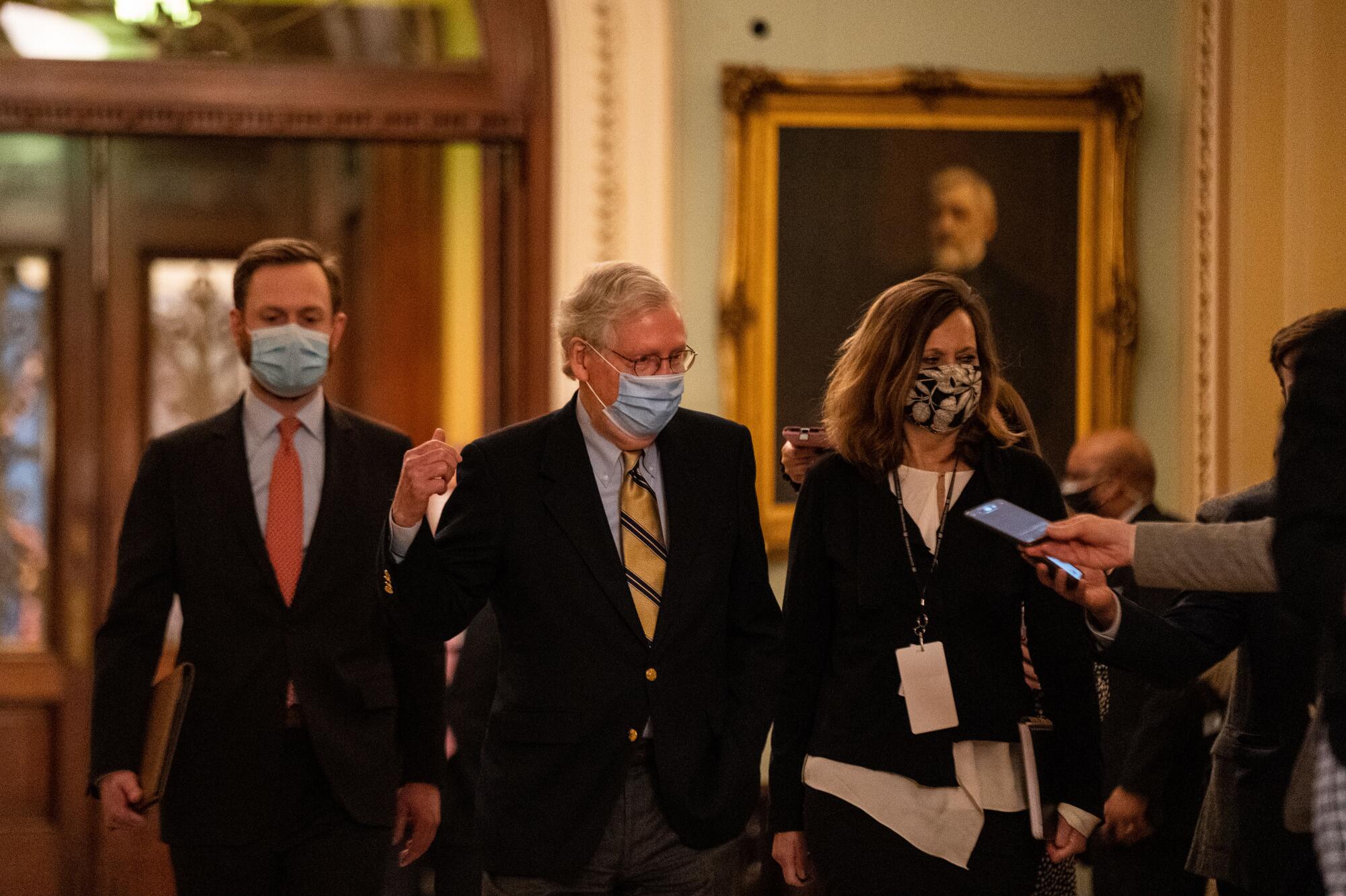 Senate Minority Leader Mitch McConnell walks to his office in the U.S. Capitol.