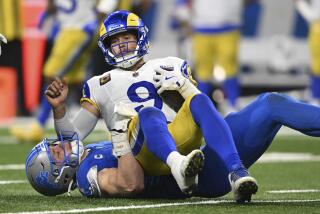 Detroit Lions defensive end Aidan Hutchinson (97) sacks Los Angeles Rams.