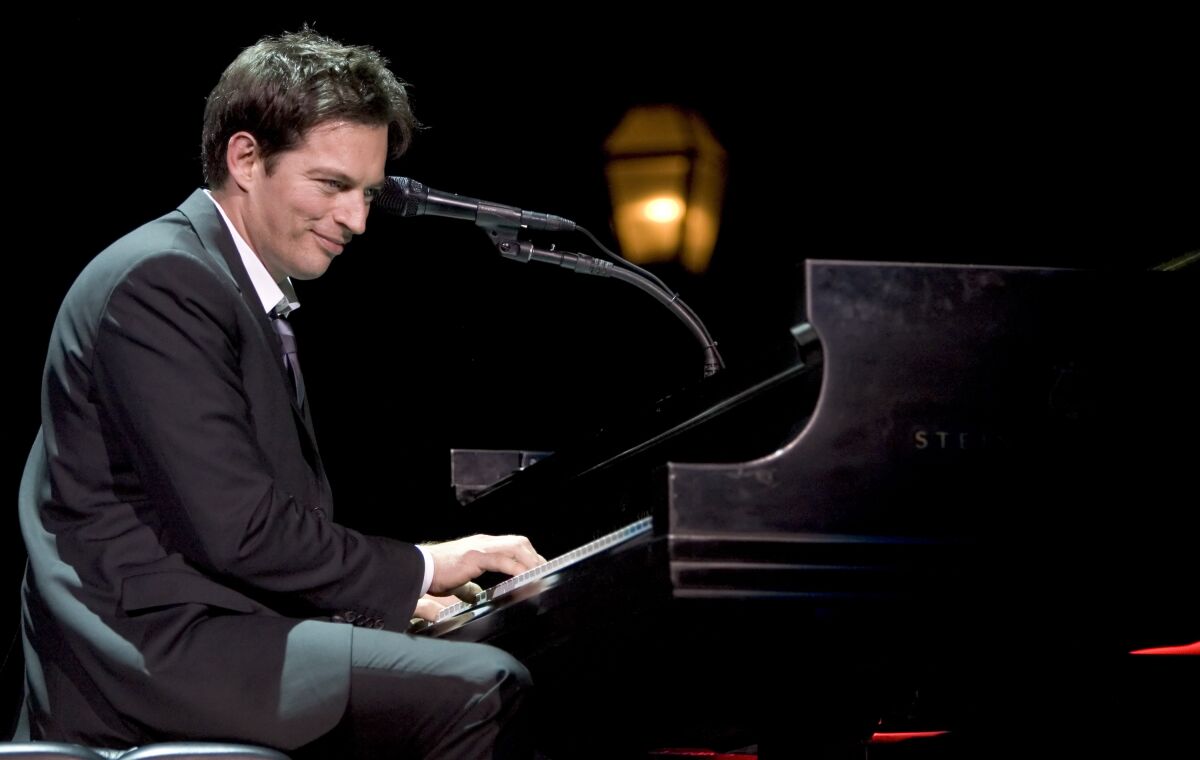 Harry Connick Jr. plays the piano