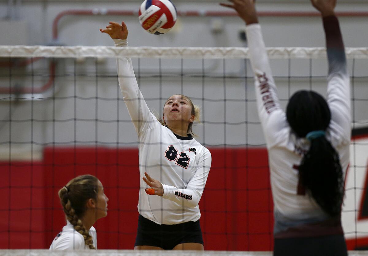 Huntington Beach's Addison Williams (82) hits against Torrance during the Lakewood Molten Classic at Artesia High.