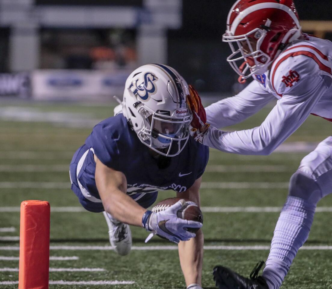 St. John Bosco wide receiver Logan Loya dives for a touchdown against Mater Dei.