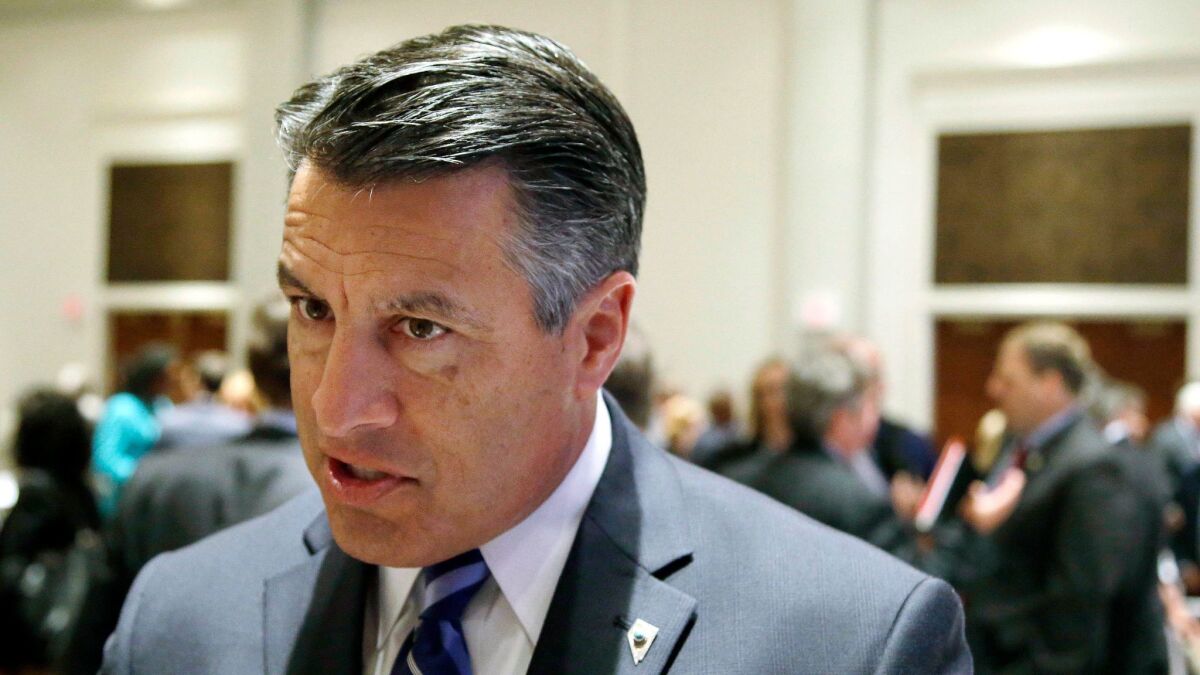 Nevada Republican Gov. Brian Sandoval, attending the National Governors Assn. meeting in Providence, R.I., has strong reservations about the GOP healthcare bill in the Senate.
