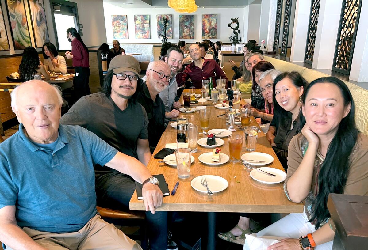 Peter Arnett, left, Tony Bui, second from left, Pulitzer Prize-winning photographer David Hume Kennerly,