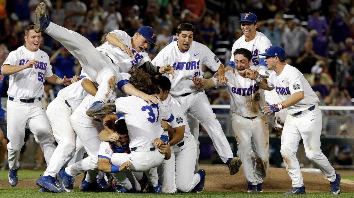 Florida players celebrate after defeating LSU in Game 2 to win the NCAA College World Series in Omaha, Neb., Tuesday.