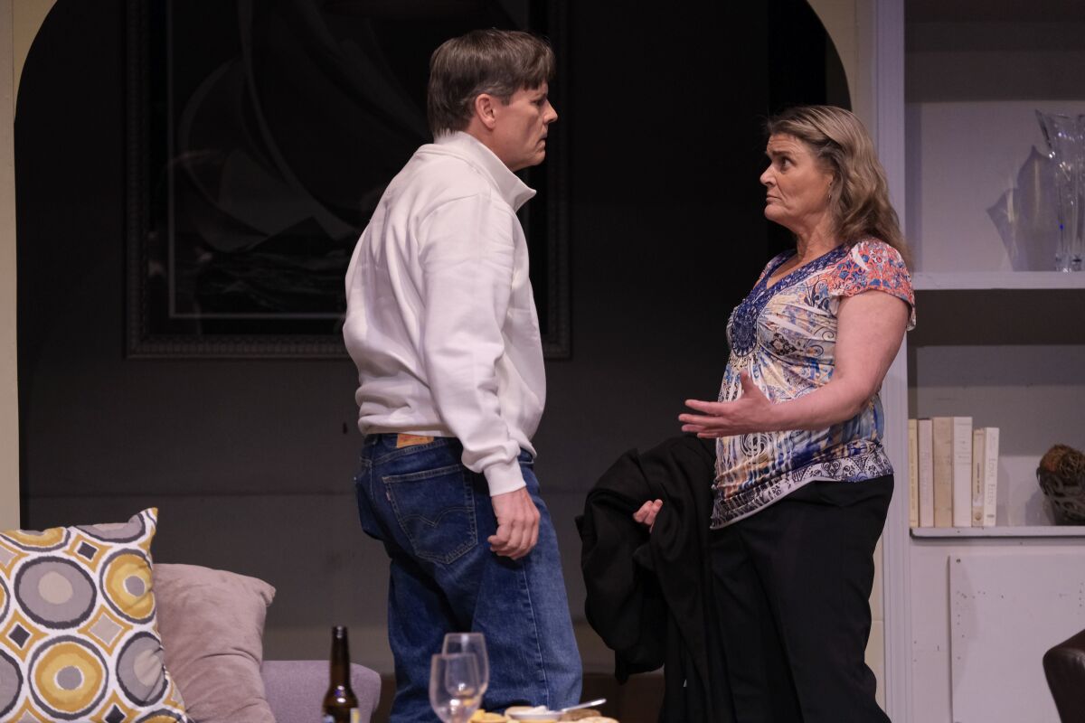 A man and a woman have an argument in a stage play.