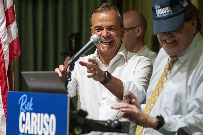 L.A. mayoral candidate Rick Caruso, left, hosts an event with seniors at Horace Heidt Estates on Wednesday.