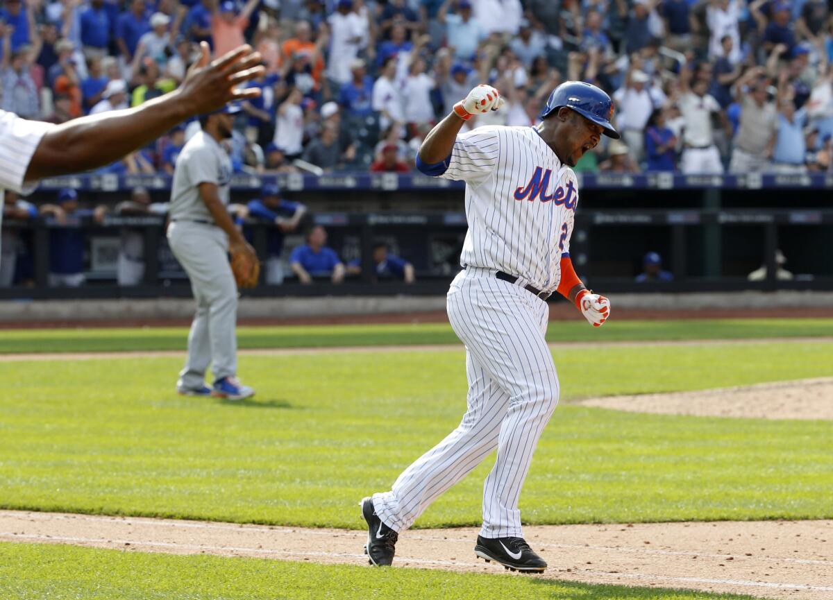 Mets third baseman Juan Uribe celebrates after hitting a walk-off single against his former team, the Dodgers.