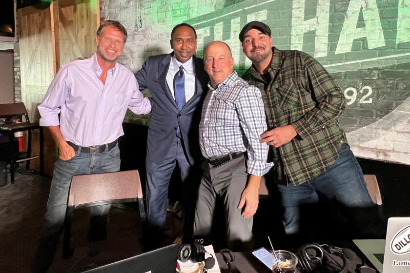 Co-hosts Mike Felger, left, and Tony Massarotti, right, with Jim Murray, an on-air contributor, and Stephen A. Smith.