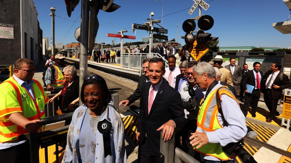 A bill in Sacramento would have added eight members to the Metro Board of Directors. Above, L.A. Mayor Eric Garcetti, center, and Metro officials at a celebration for the 25th anniversary of the Blue Line.