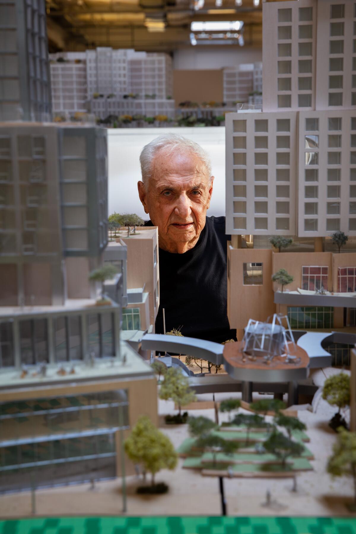 Architect Frank Gehry is photographed with a model of the Grand at his offices in Los Angeles.
