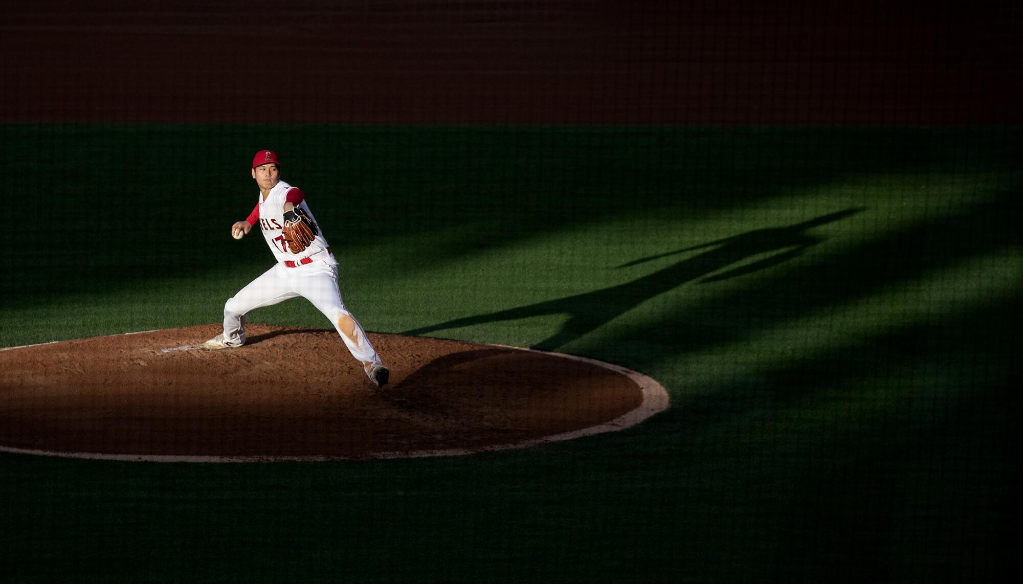 Angels starting pitcher Shohei Ohtani delivers a pitch in the third inning against the Dodgers at Angel Stadium on June 21.