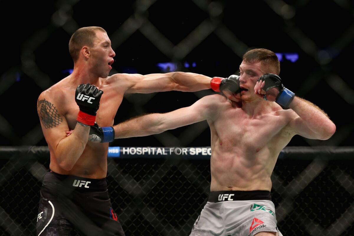 James Vick lands a punch against Joe Duffy during their lightweight bout at UFC 217.