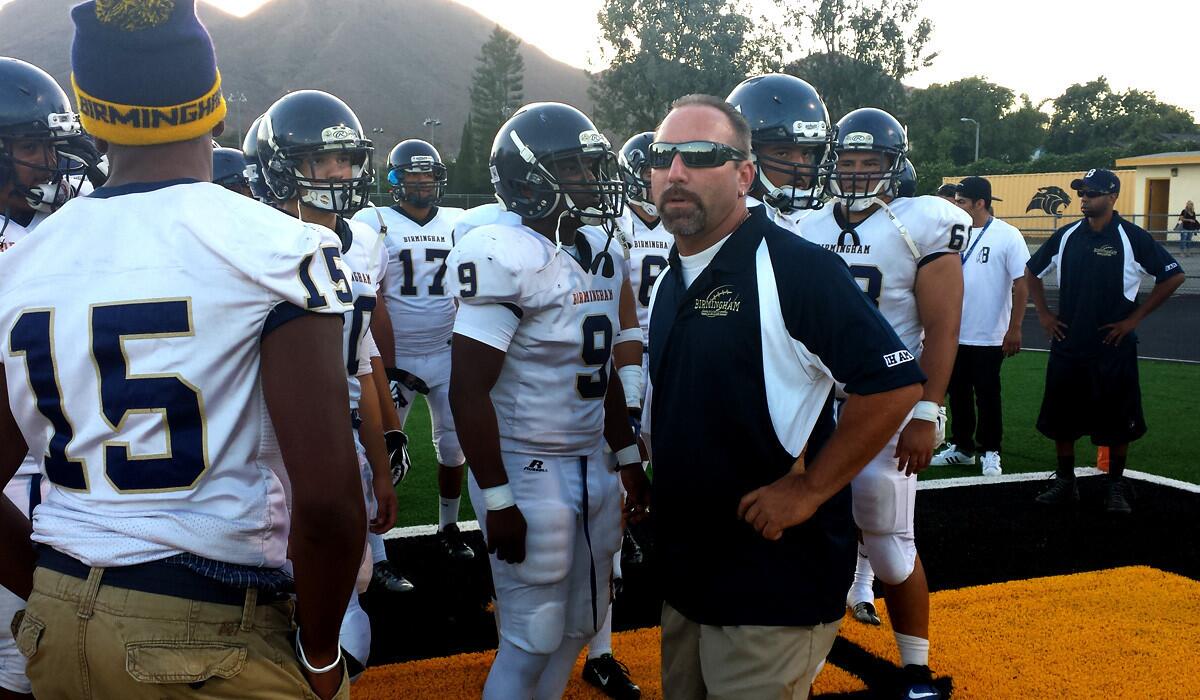 Birmingham Coach Jim Rose and his players prepare for their season opener at Newbury Park on Friday evening.