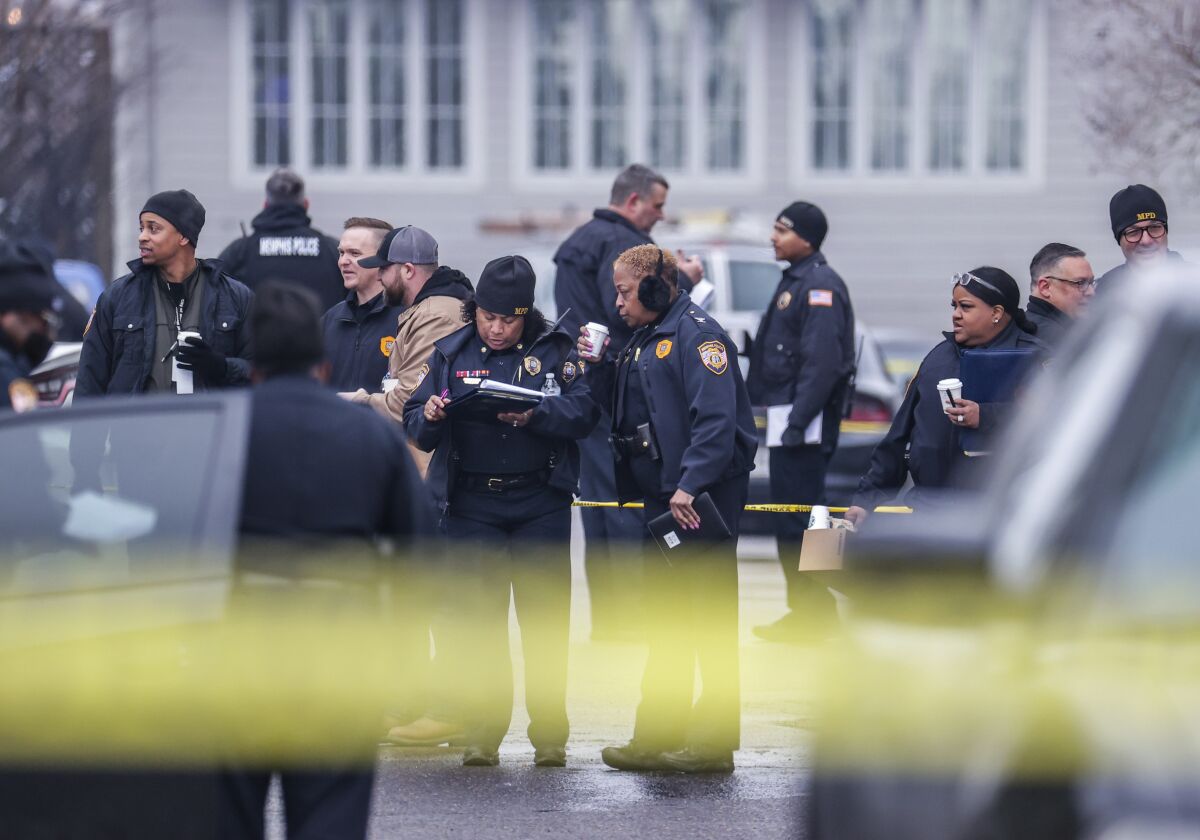 Law enforcement personnel work at the scene of a shooting at a Tennessee library, Thursday, Feb. 2, 2023, in Memphis. Authorities say one person is dead and a police officer was critically wounded. (Patrick Lantrip/Daily Memphian via AP)