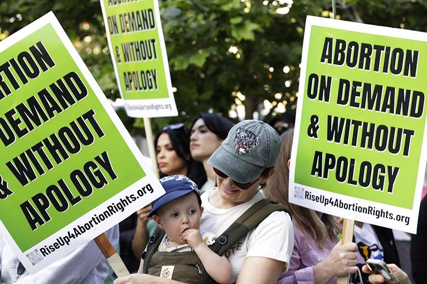 Anna Hewson and her 1-year-old son Poppy attend a pro-choice rally in downtown Los Angeles on Wednesday.