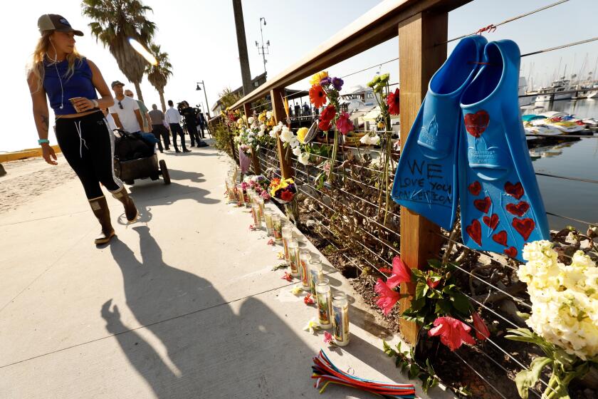 SANTA BARBARA CA SEPTEMBER 3, 2019 -- A memorial is growing at Santa Barbara Harbor where the dive boat Conception was based Tuesday morning, September 3, 2019. (Al Seib / Los Angeles Times)